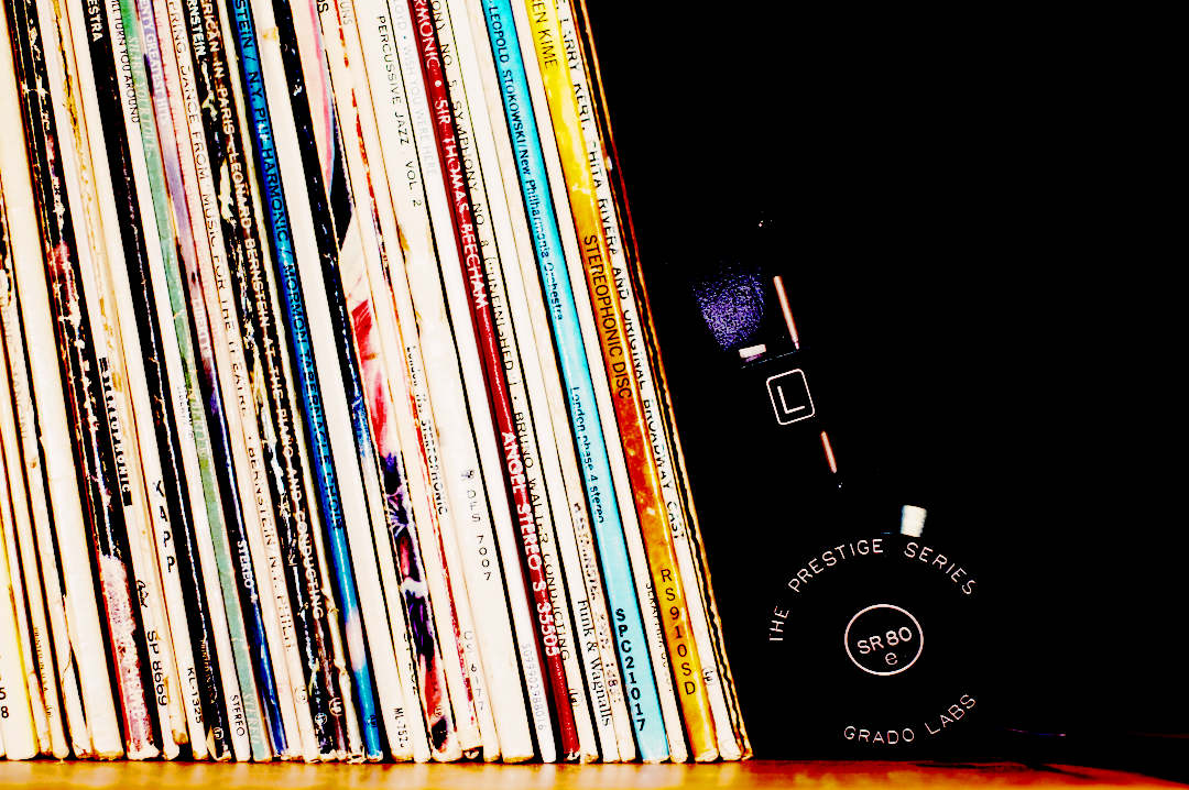 headphones and records on a shelf